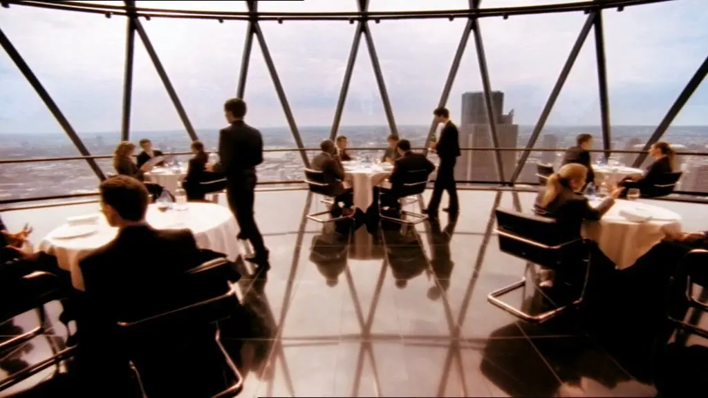 Diners at white tables under the diamond glazing of the dome, the City beyond