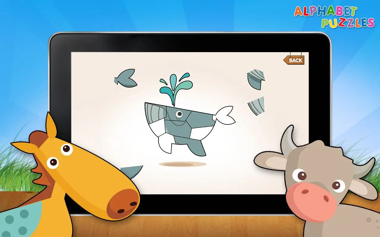 Kizzu’s Alphabet Puzzles on a tablet: a whale jigsaw, with a cartoon giraffe and cow peeking in